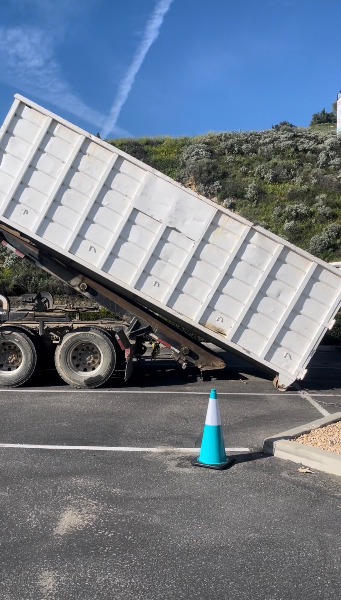 White container being unloaded